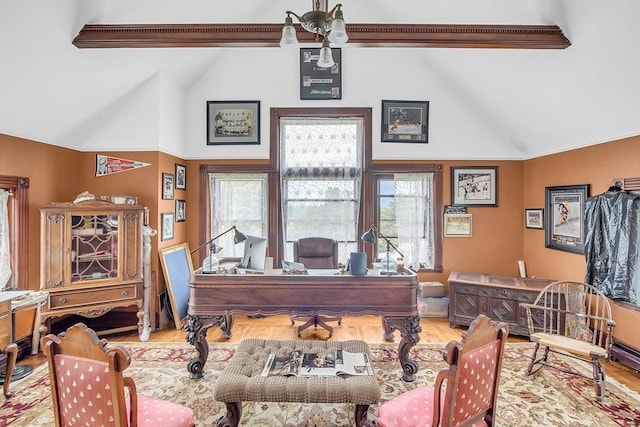 home office featuring hardwood / wood-style flooring and high vaulted ceiling