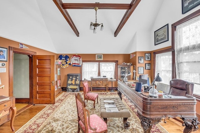 office area featuring an inviting chandelier, beam ceiling, high vaulted ceiling, and light wood-type flooring