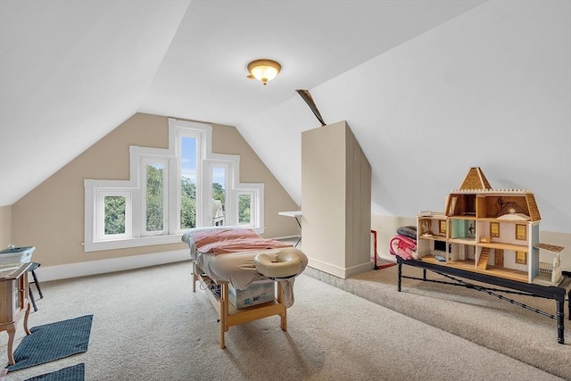 bedroom featuring light carpet and lofted ceiling