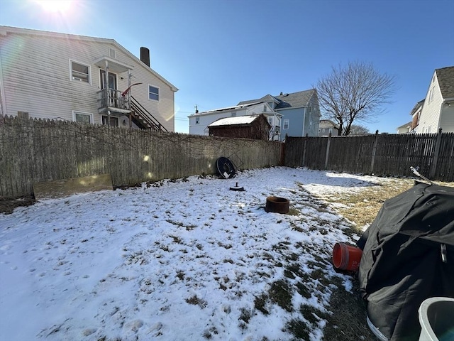 view of yard covered in snow