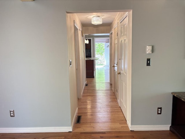 194 Paine St, Bellingham, MA 02019 - hall with light wood-style floors, baseboards, and visible vents