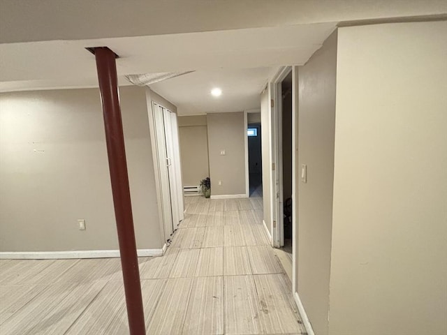 194 Paine St, Bellingham, MA 02019 - corridor featuring baseboards, light wood-style flooring, and baseboard heating