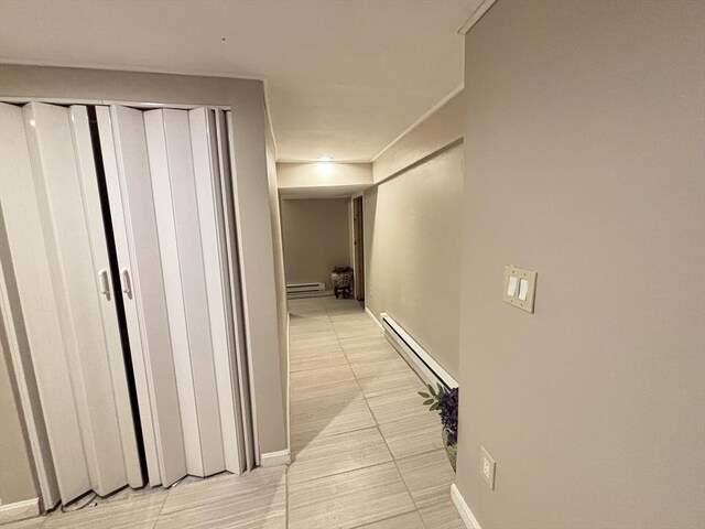 194 Paine St, Bellingham, MA 02019 - hallway featuring baseboards, crown molding, light tile patterned flooring, and baseboard heating