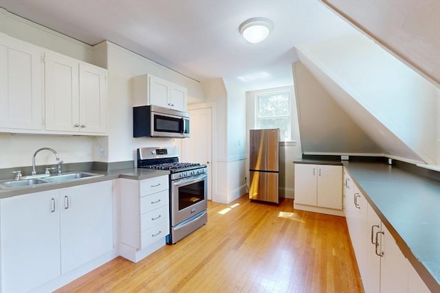 12 Bigelow Cir Unit 3, Boston, MA 02135 - kitchen featuring stainless steel appliances, light wood-style flooring, and white cabinets