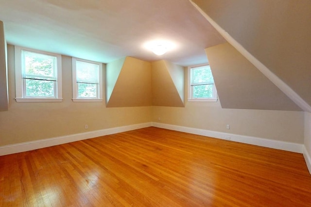 12 Bigelow Cir Unit 3, Boston, MA 02135 - additional living space featuring light wood-style floors and vaulted ceiling