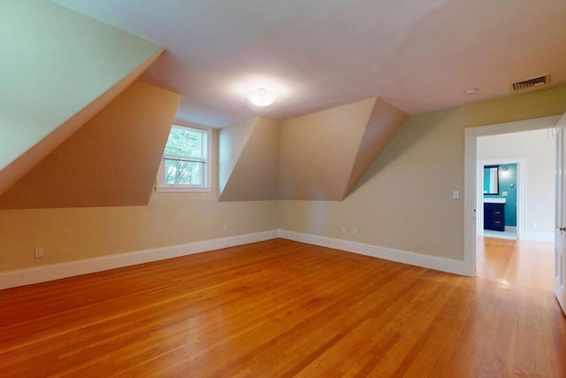 12 Bigelow Cir Unit 3, Boston, MA 02135 - additional living space with light wood-style floors and lofted ceiling