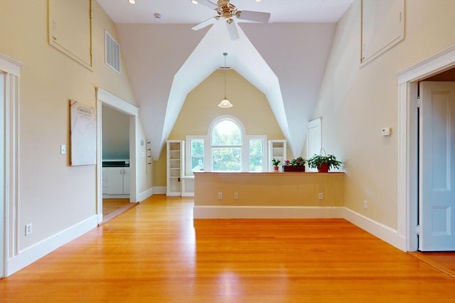 12 Bigelow Cir Unit 3, Boston, MA 02135 - unfurnished living room with ceiling fan, light wood-type flooring, and lofted ceiling