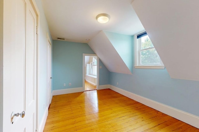 12 Bigelow Cir Unit 3, Boston, MA 02135 - additional living space featuring light wood-style flooring and vaulted ceiling