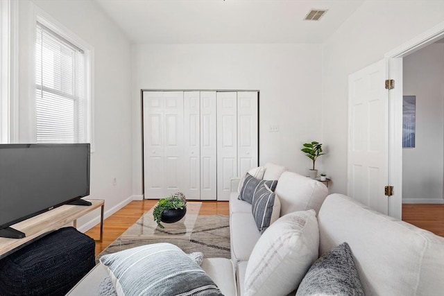 living room with light hardwood / wood-style flooring