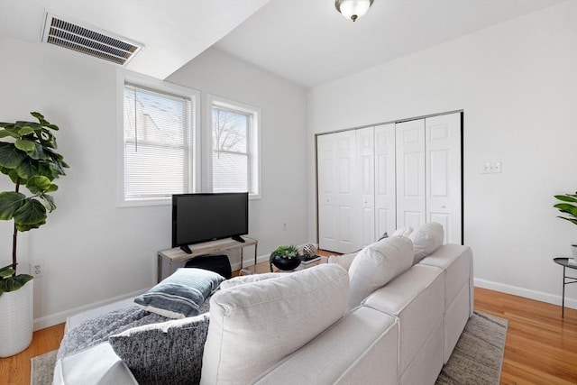 living room with light hardwood / wood-style flooring