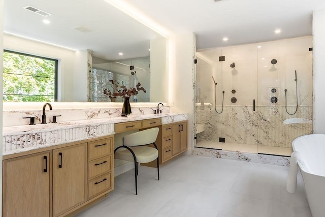 bathroom featuring vanity and a shower with door