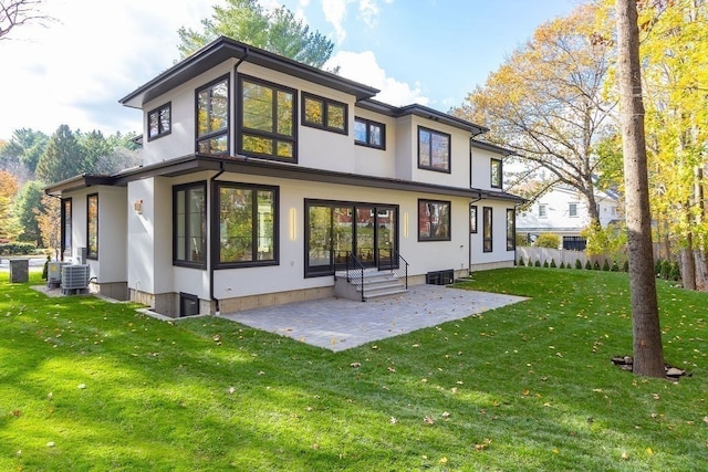 rear view of property with a yard