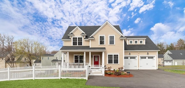 4 Curley Cir, Ayer, MA 01432 - view of front facade with covered porch, driveway, a gate, fence private yard, and a shingled roof