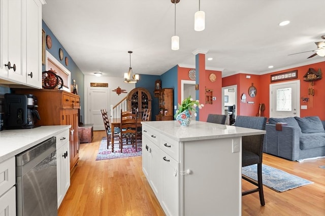 4 Curley Cir, Ayer, MA 01432 - kitchen featuring stainless steel dishwasher, open floor plan, a kitchen breakfast bar, white cabinets, and light wood-style flooring