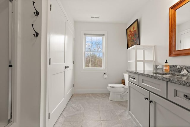 4 Curley Cir, Ayer, MA 01432 - bathroom featuring toilet, baseboards, visible vents, and vanity