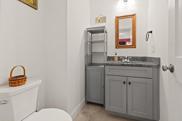 4 Curley Cir, Ayer, MA 01432 - half bathroom featuring baseboards, vanity, and toilet