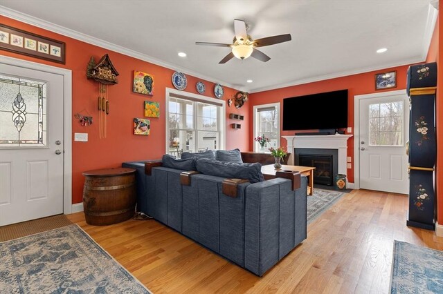 4 Curley Cir, Ayer, MA 01432 - living area featuring ornamental molding, ceiling fan, recessed lighting, a fireplace with flush hearth, and light wood-style flooring