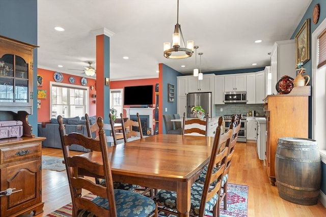 4 Curley Cir, Ayer, MA 01432 - dining room with ornamental molding, light wood finished floors, ceiling fan with notable chandelier, and recessed lighting