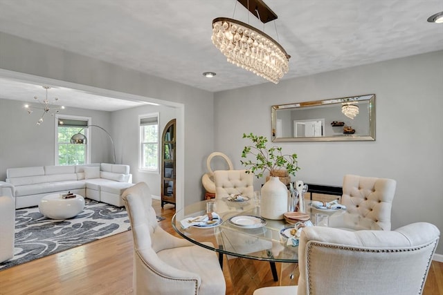 7 Sequoia Dr, Wilmington, MA 01887 - dining area featuring a chandelier, wood finished floors, and baseboards