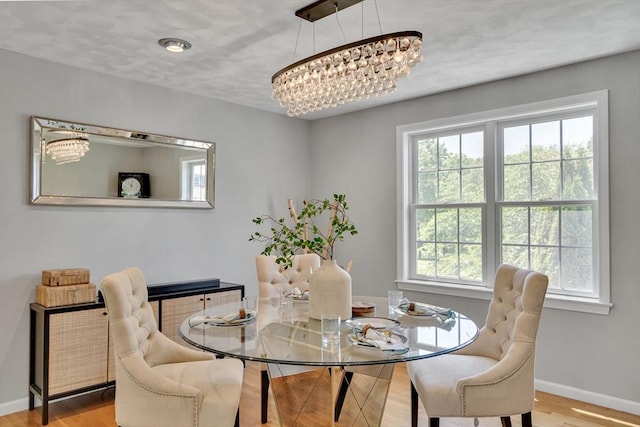 7 Sequoia Dr, Wilmington, MA 01887 - dining room featuring a chandelier, healthy amount of natural light, baseboards, and wood finished floors