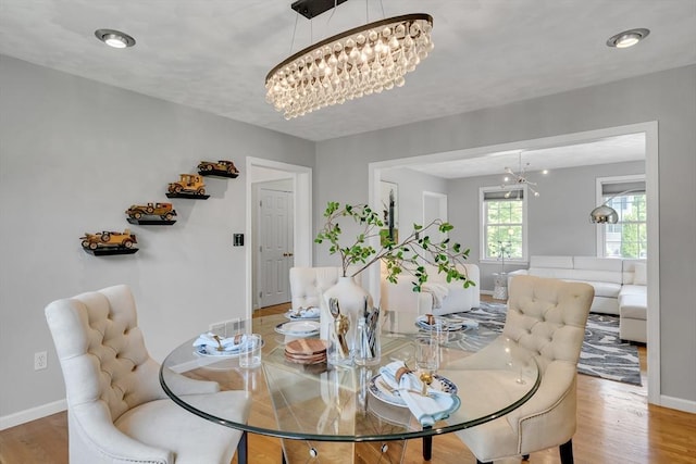 7 Sequoia Dr, Wilmington, MA 01887 - dining area featuring a chandelier, baseboards, and light wood-type flooring