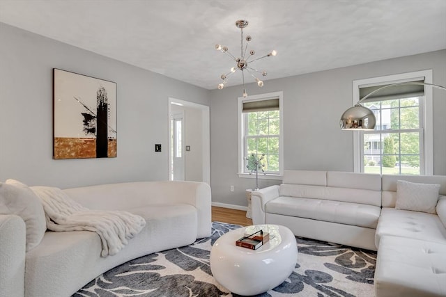 7 Sequoia Dr, Wilmington, MA 01887 - living room featuring wood finished floors, a chandelier, and baseboards
