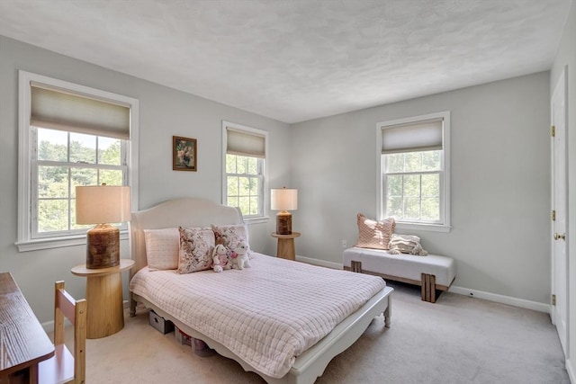 7 Sequoia Dr, Wilmington, MA 01887 - bedroom featuring multiple windows, light colored carpet, and baseboards