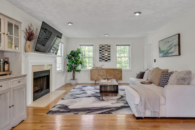 7 Sequoia Dr, Wilmington, MA 01887 - living area featuring a fireplace, light wood finished floors, recessed lighting, and baseboards