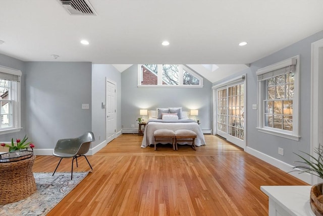 bedroom featuring recessed lighting, visible vents, vaulted ceiling with skylight, and light wood-type flooring