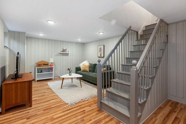 living area featuring stairway, recessed lighting, and light wood-style floors