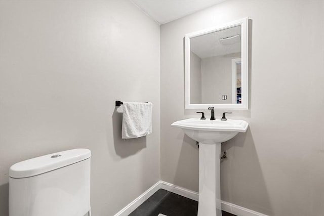 3 42nd St, Berkley, MA 02779 - half bath with toilet and tile patterned flooring