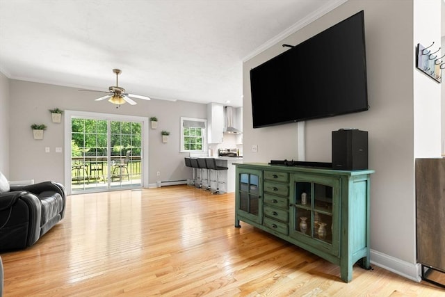 3 42nd St, Berkley, MA 02779 - living room with ceiling fan, a baseboard radiator, light wood-type flooring, and ornamental molding