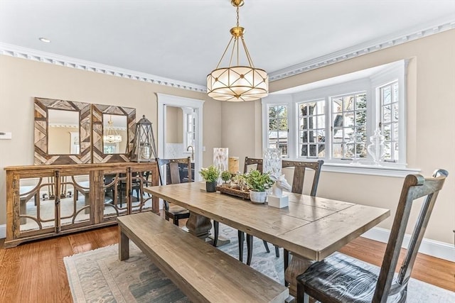 dining room with wood finished floors and baseboards