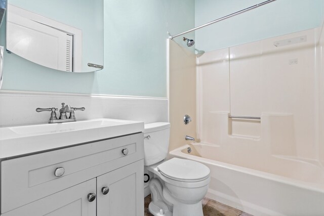 full bathroom featuring toilet, shower / bathing tub combination, and vanity