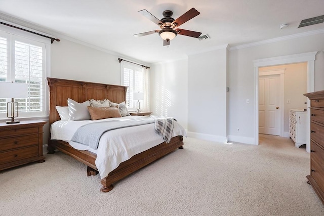 bedroom with ornamental molding, light colored carpet, and ceiling fan