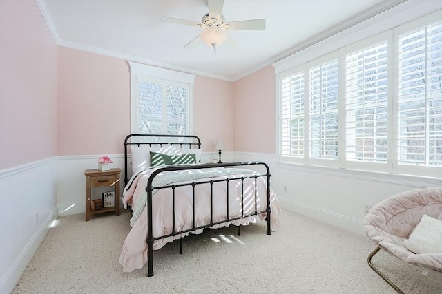 bedroom with ornamental molding and ceiling fan