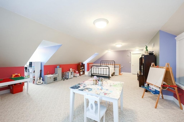 recreation room with lofted ceiling and carpet