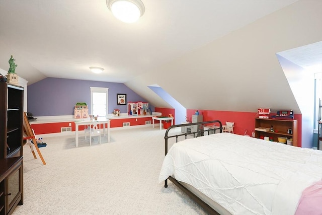 bedroom featuring carpet flooring and vaulted ceiling