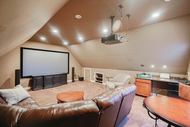 carpeted home theater room featuring lofted ceiling