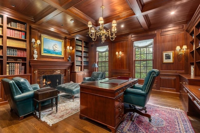 office area featuring coffered ceiling, wood ceiling, beam ceiling, and built in features