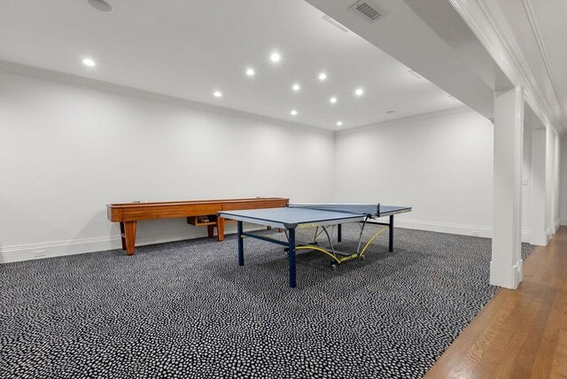 recreation room featuring crown molding and wood-type flooring