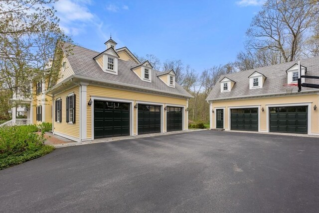 exterior space with an outbuilding and a garage