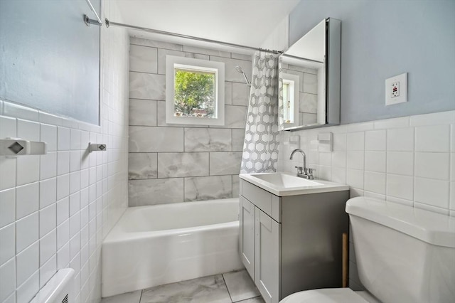 993 Shirley St, Winthrop, MA 02152 - bathroom with tile walls, toilet, vanity, shower / bath combination with curtain, and radiator