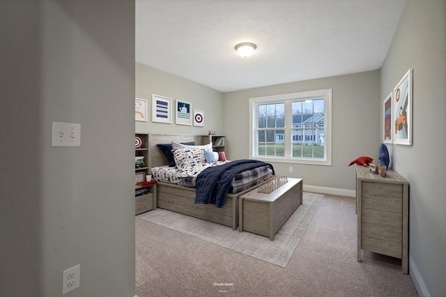 bedroom featuring light colored carpet