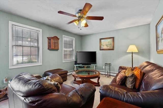 carpeted living room featuring ceiling fan, a baseboard radiator, and plenty of natural light