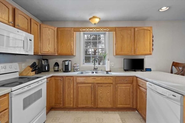 kitchen featuring sink and white appliances