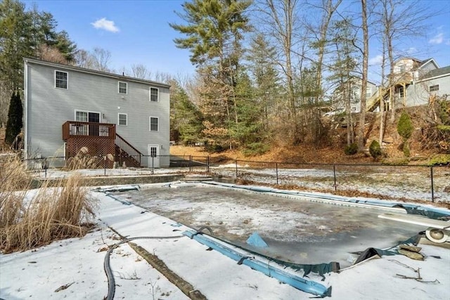 snow covered pool with a deck