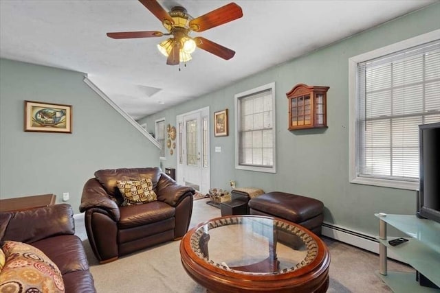 living room with light carpet, a baseboard radiator, and ceiling fan