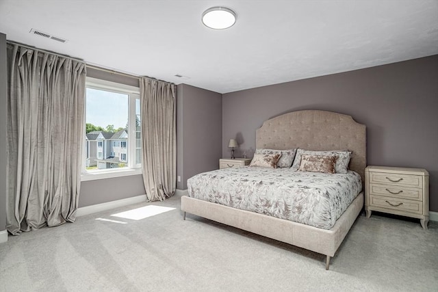 bedroom featuring baseboards and carpet