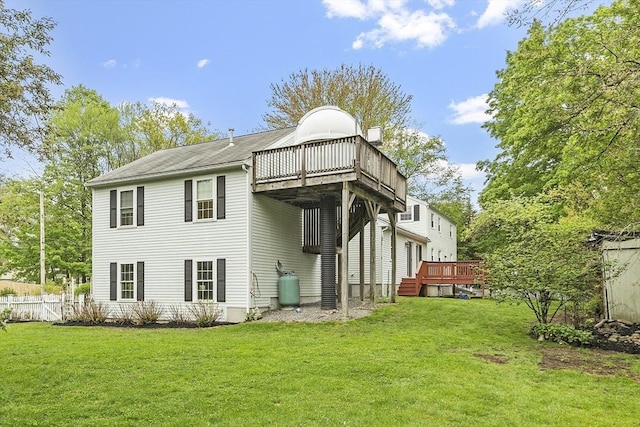 rear view of property featuring a deck